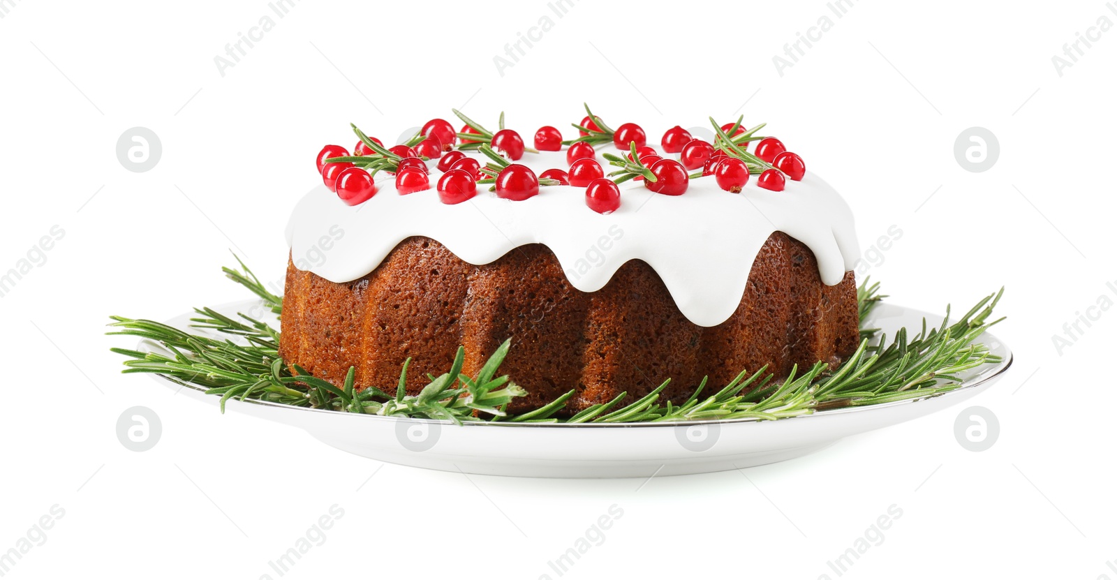 Photo of Traditional Christmas cake decorated with currants and rosemary isolated on white