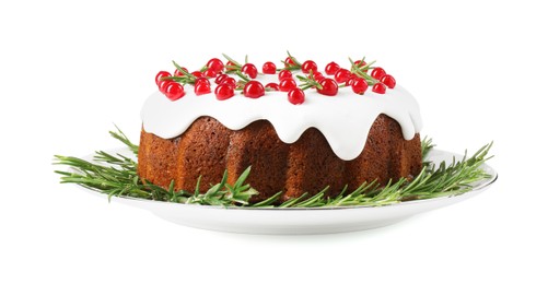 Photo of Traditional Christmas cake decorated with currants and rosemary isolated on white