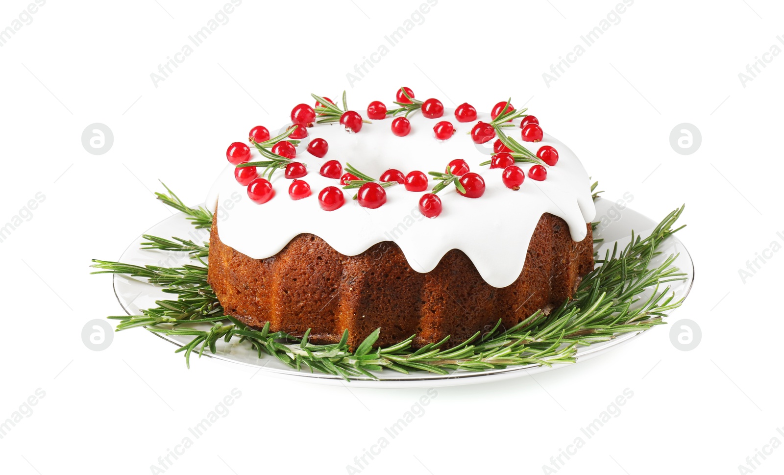 Photo of Traditional Christmas cake decorated with currants and rosemary isolated on white