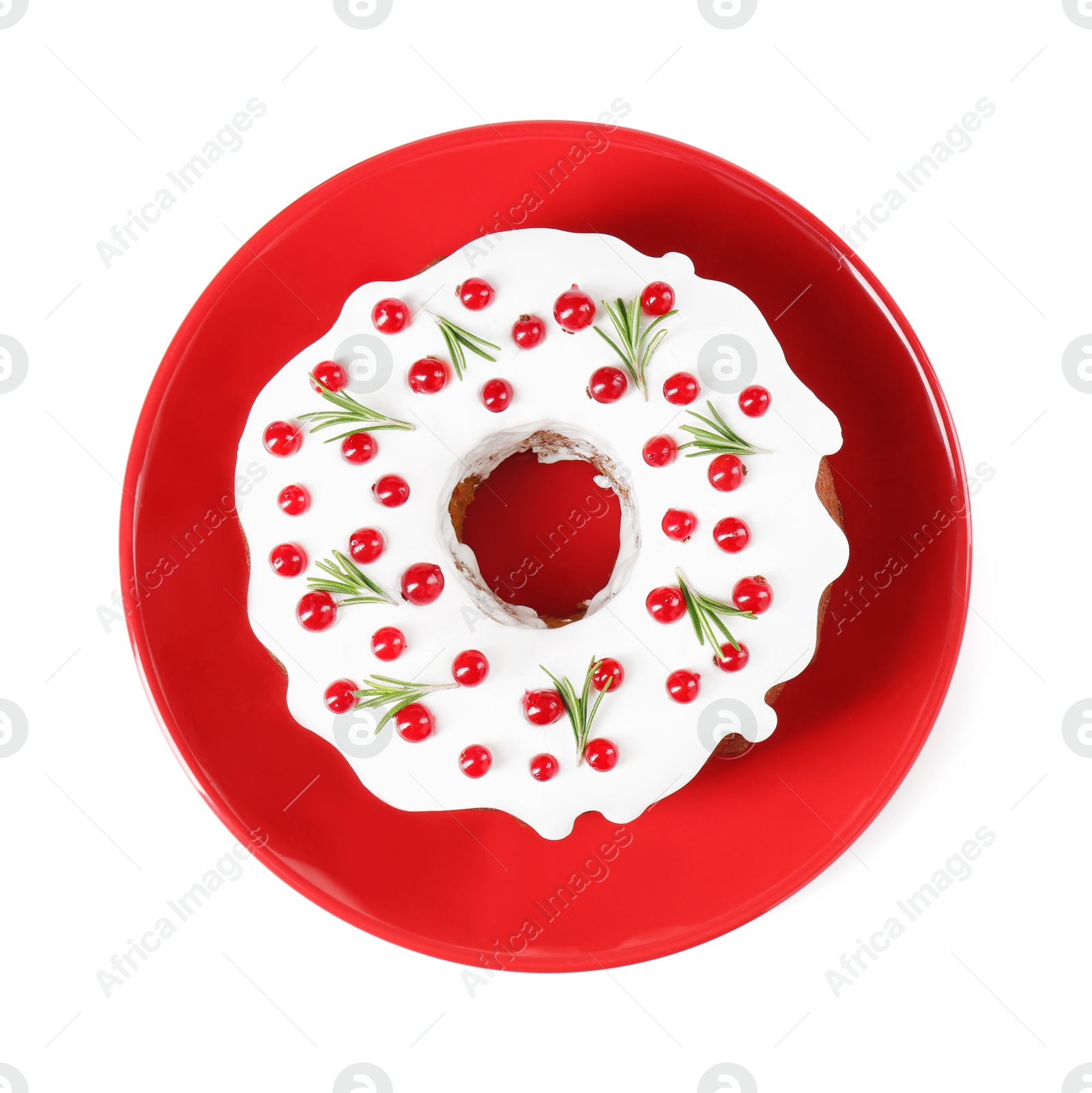 Photo of Traditional Christmas cake decorated with currants and rosemary isolated on white, top view