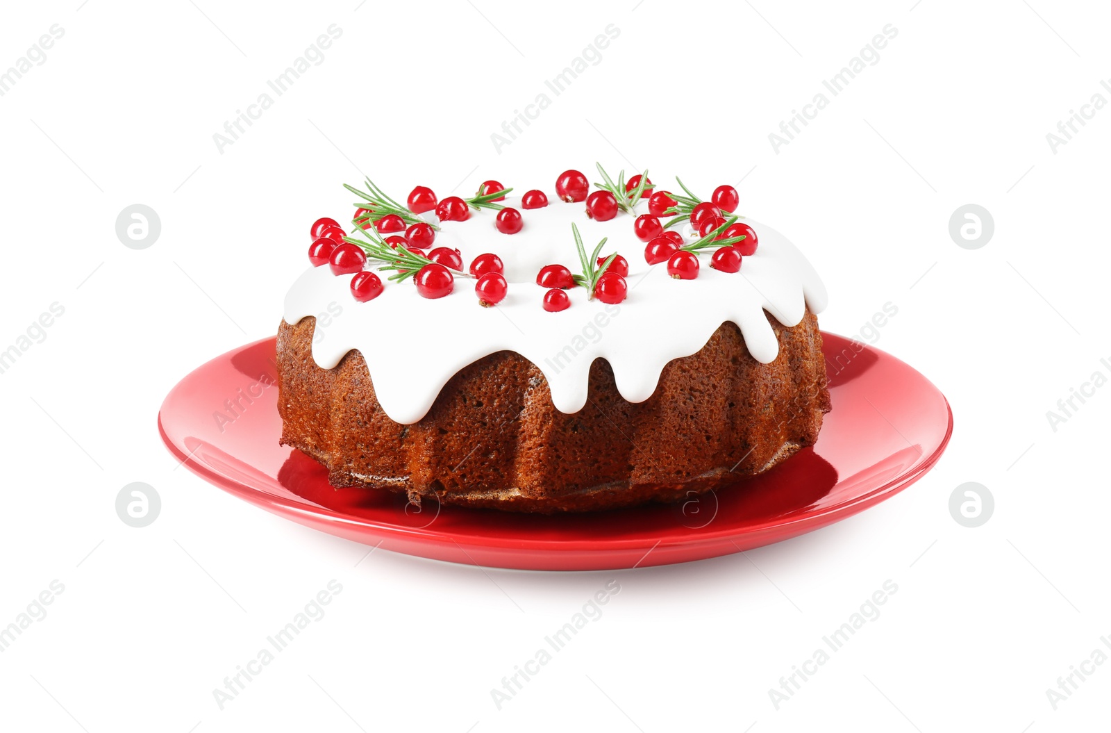 Photo of Traditional Christmas cake decorated with currants and rosemary isolated on white