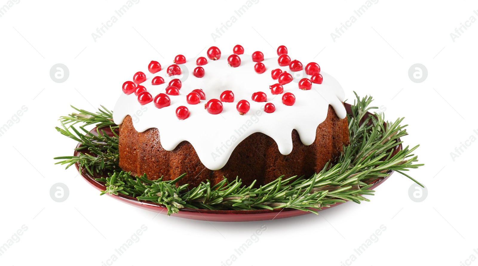 Photo of Traditional Christmas cake decorated with currants and rosemary isolated on white