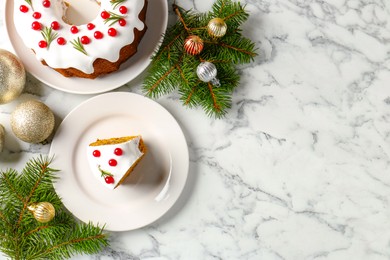 Photo of Traditional classic Christmas cake and decor on white marble table, flat lay. Space for text