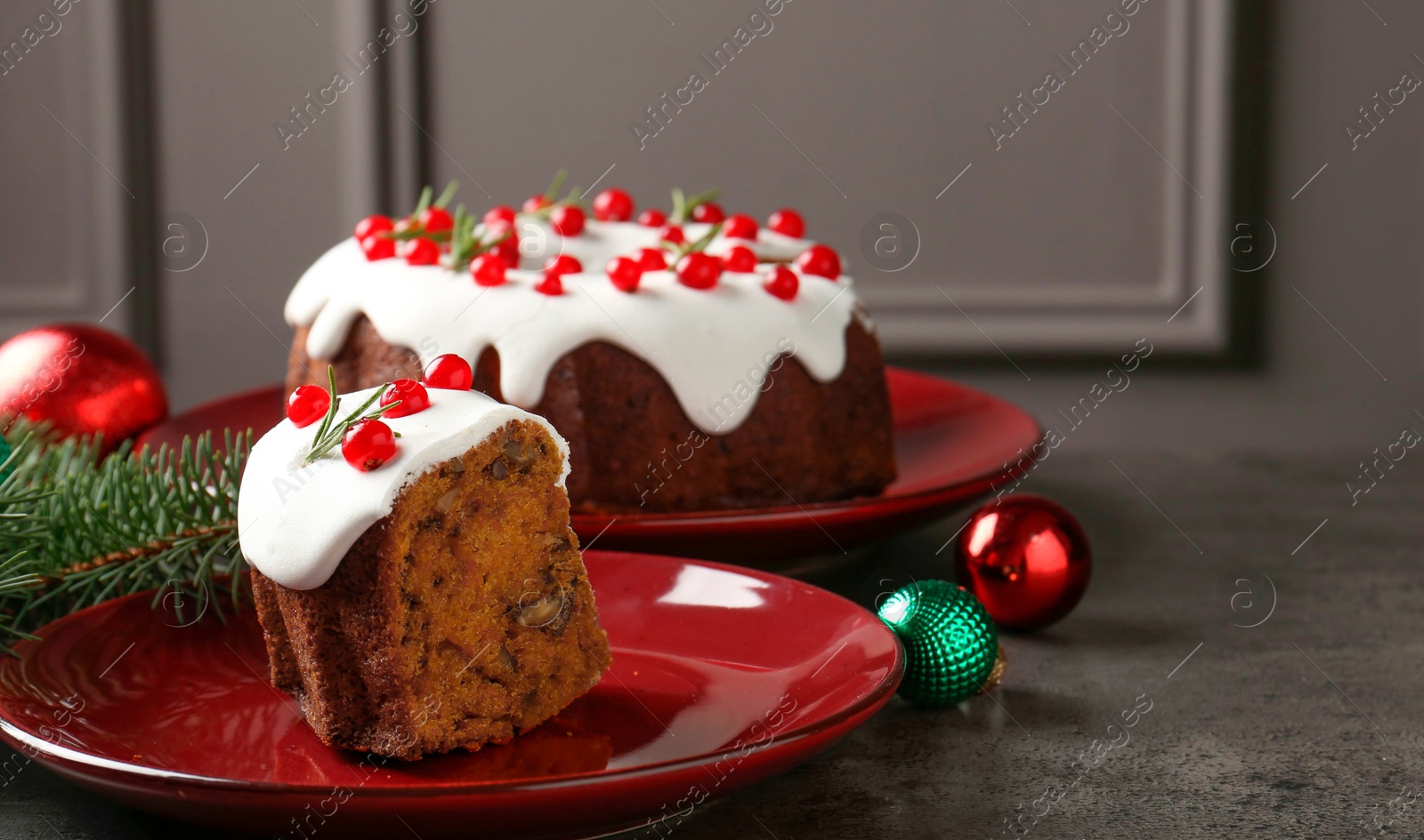 Photo of Traditional classic Christmas cake and decor on gray textured table