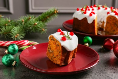 Photo of Traditional classic Christmas cake and decor on gray textured table