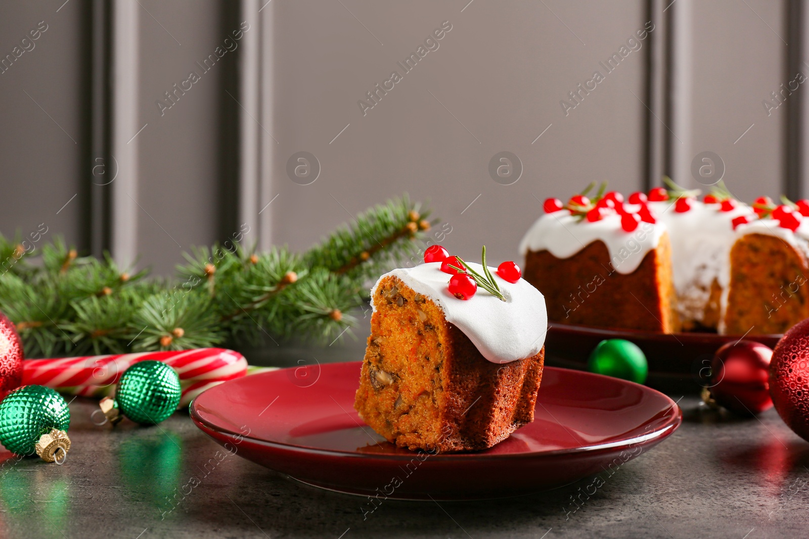 Photo of Traditional classic Christmas cake and decor on gray textured table