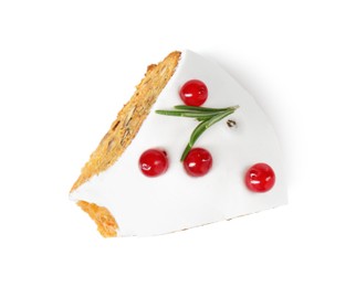 Photo of Piece of traditional Christmas cake decorated with red currants and rosemary isolated on white, top view