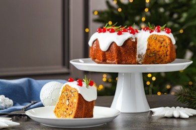 Photo of Traditional classic Christmas cake and decor on gray textured table