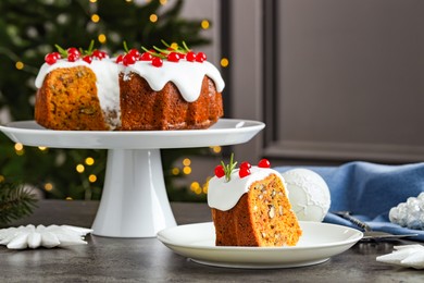 Photo of Traditional classic Christmas cake and decor on gray textured table