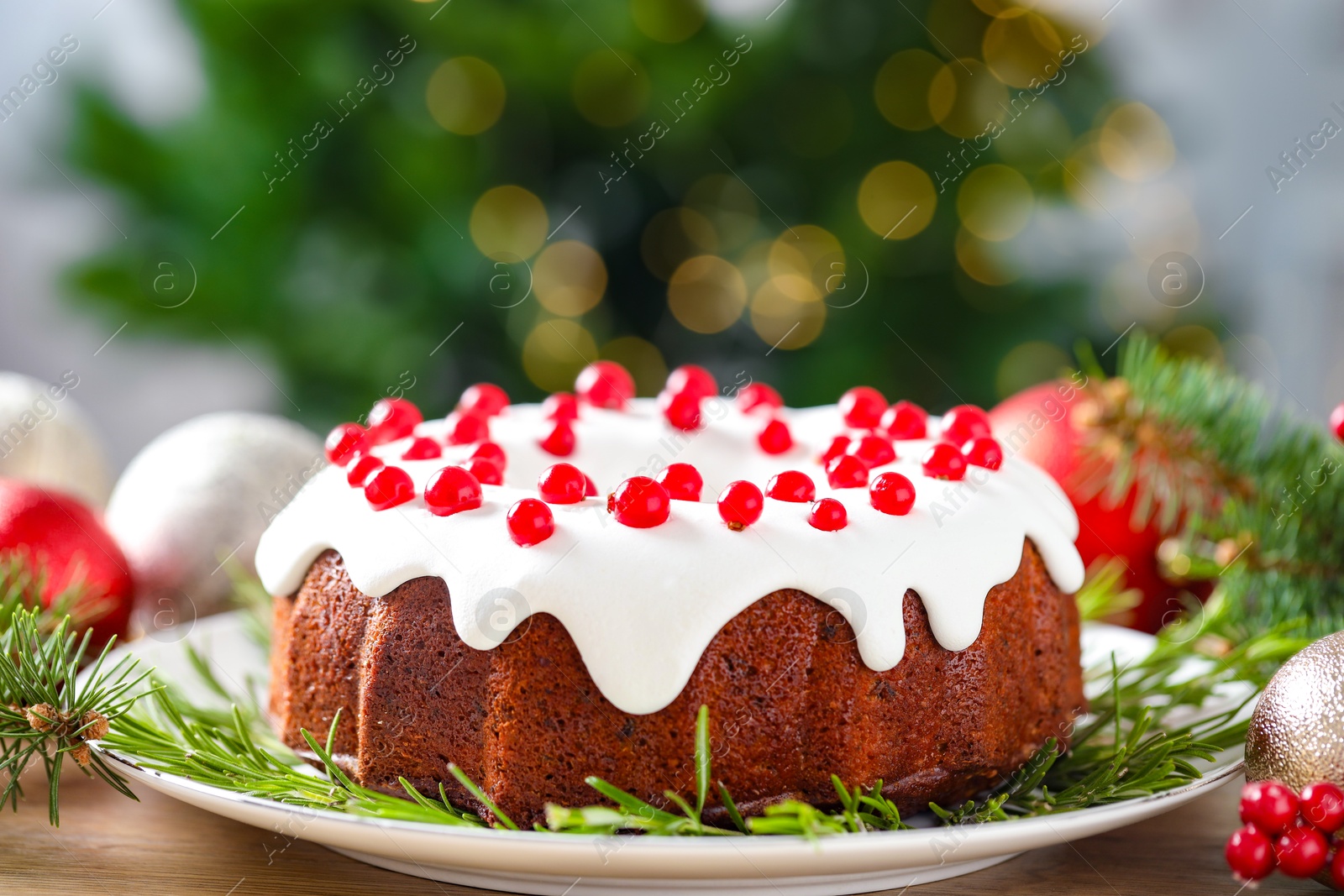 Photo of Traditional classic Christmas cake and decor on wooden table