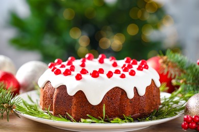 Photo of Traditional classic Christmas cake and decor on wooden table