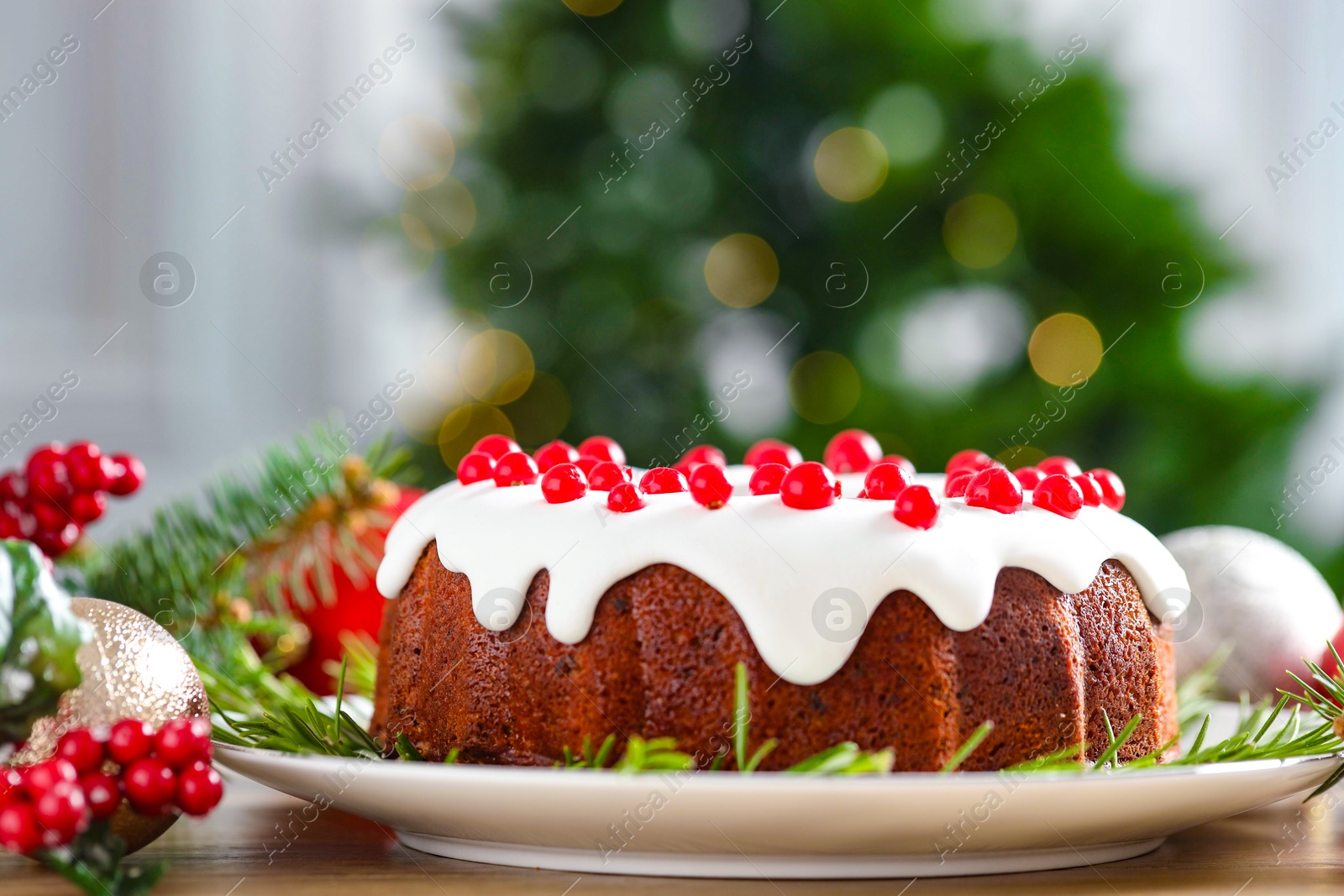 Photo of Traditional classic Christmas cake and decor on wooden table