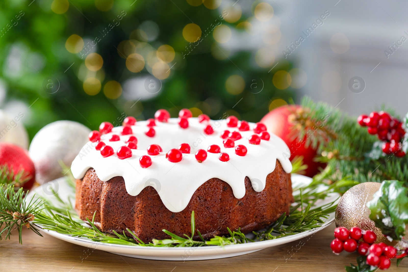 Photo of Traditional classic Christmas cake and decor on wooden table