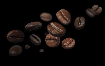 Image of Aromatic roasted coffee beans in air on black background