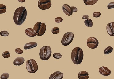 Image of Aromatic roasted coffee beans in air on beige background