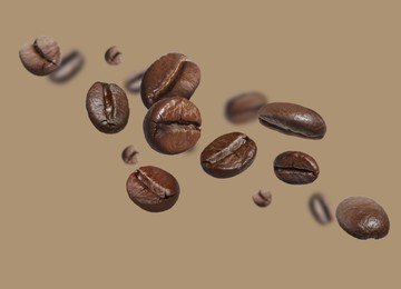 Image of Aromatic roasted coffee beans in air on grey beige background