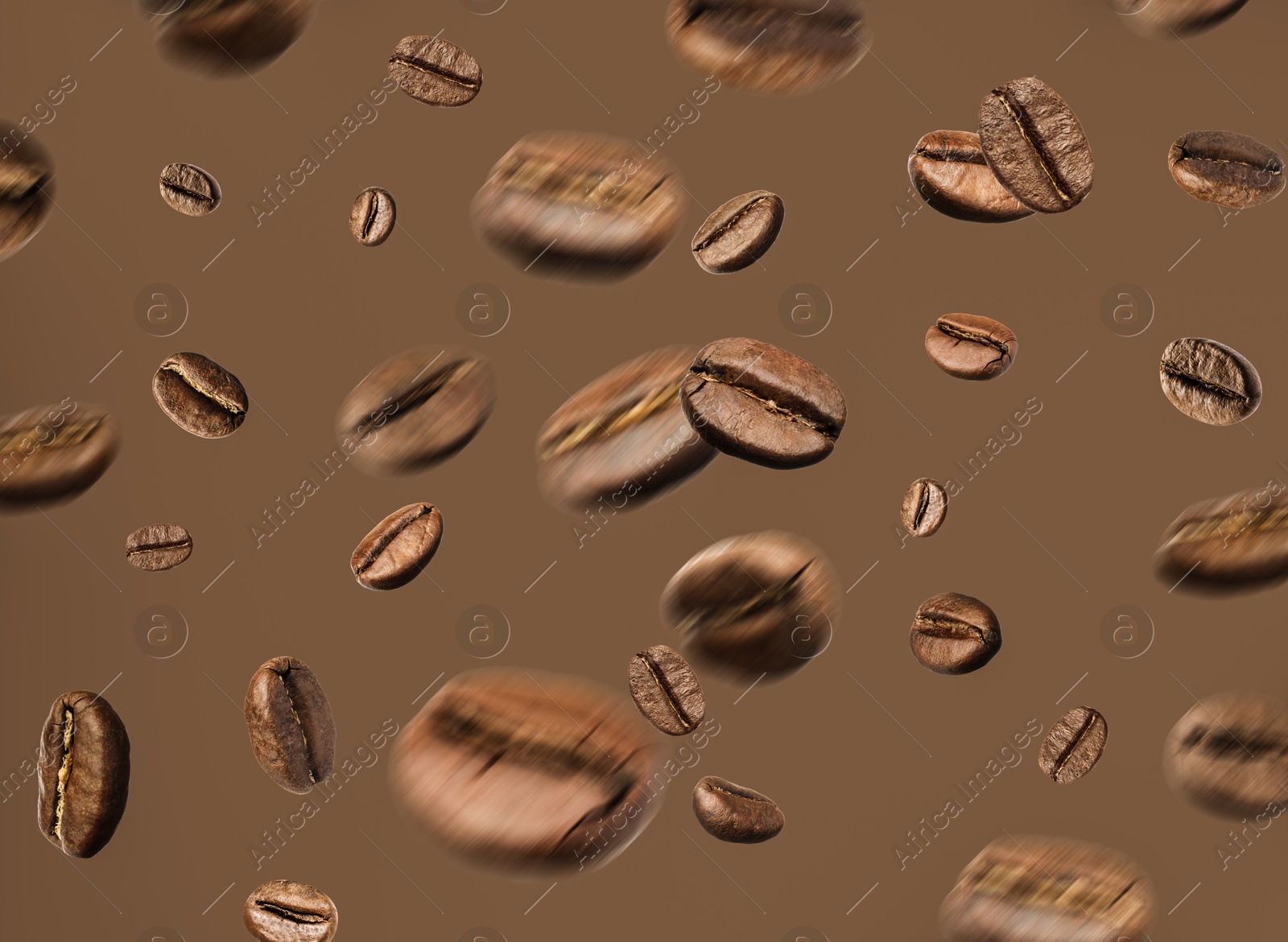 Image of Aromatic roasted coffee beans in air on brown background