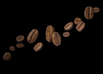 Image of Aromatic roasted coffee beans in air on black background