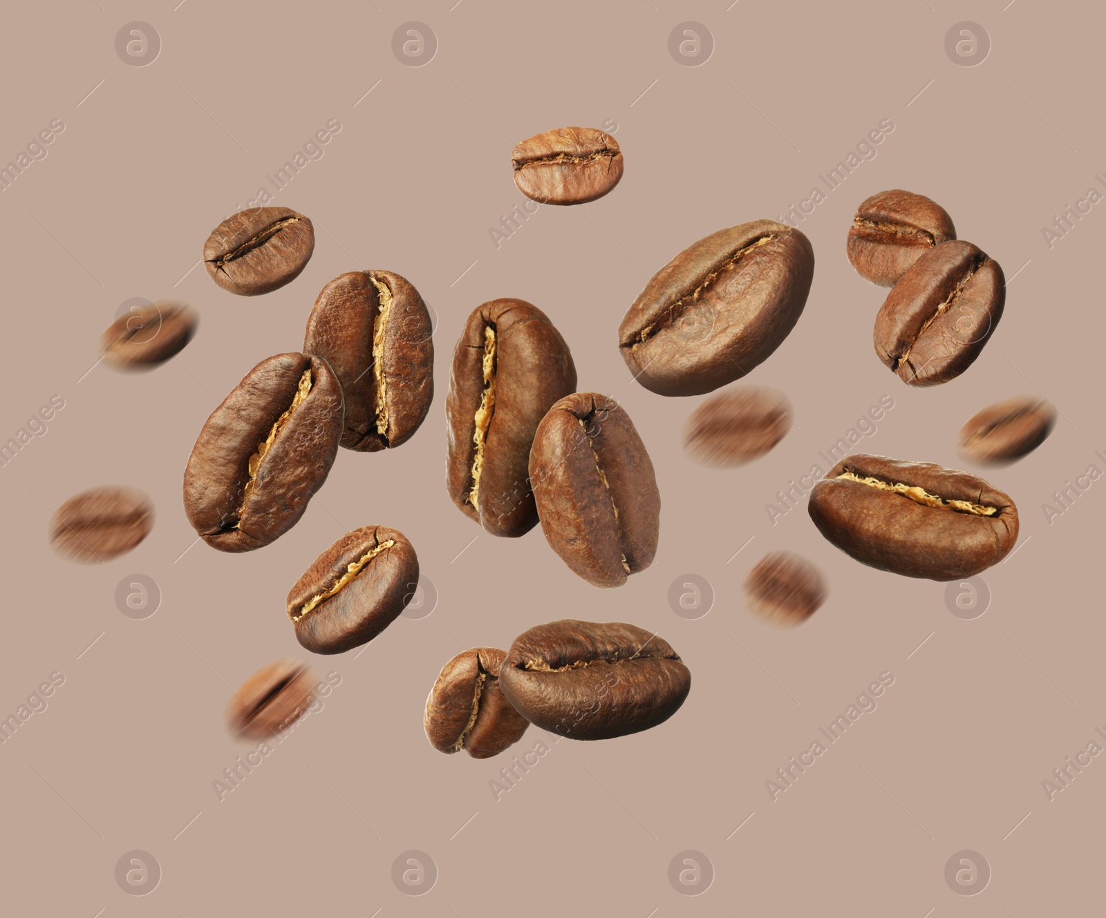 Image of Aromatic roasted coffee beans in air on beige grey background