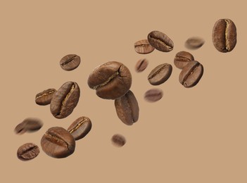 Image of Aromatic roasted coffee beans in air on dark beige background