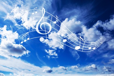 Image of Musical symbols in beautiful sky with clouds