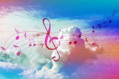 Image of Musical symbols in beautiful sky with clouds, color toned