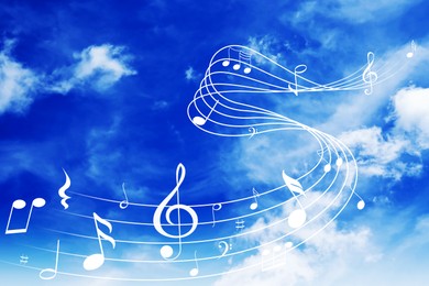 Image of Musical symbols in beautiful sky with clouds