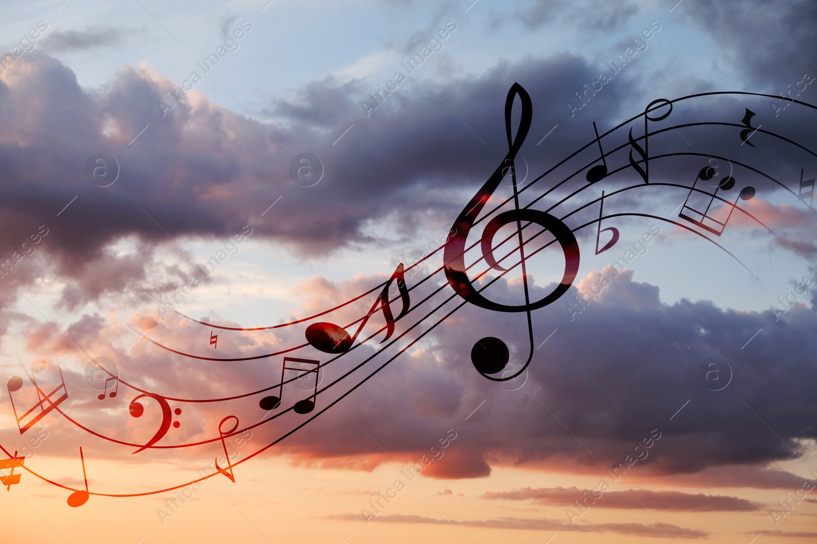 Image of Musical symbols in beautiful sunset sky with clouds