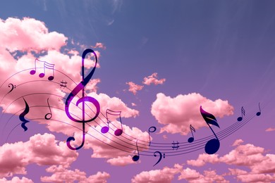 Image of Musical symbols in beautiful sky with clouds, color toned