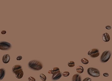 Image of Aromatic roasted coffee beans in air on dark beige background