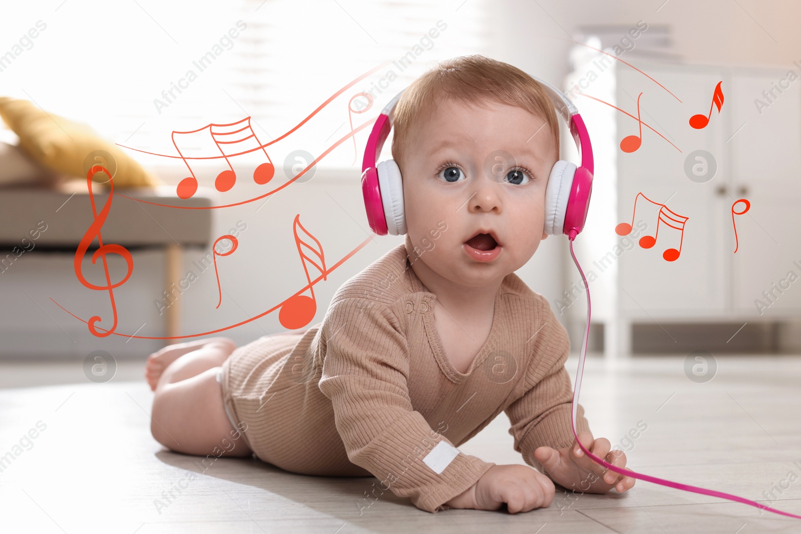 Image of Cute little baby with headphones on floor at home. Music notes flying around