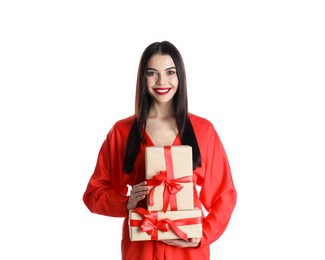 Photo of Woman in red dress holding Christmas gifts on white background