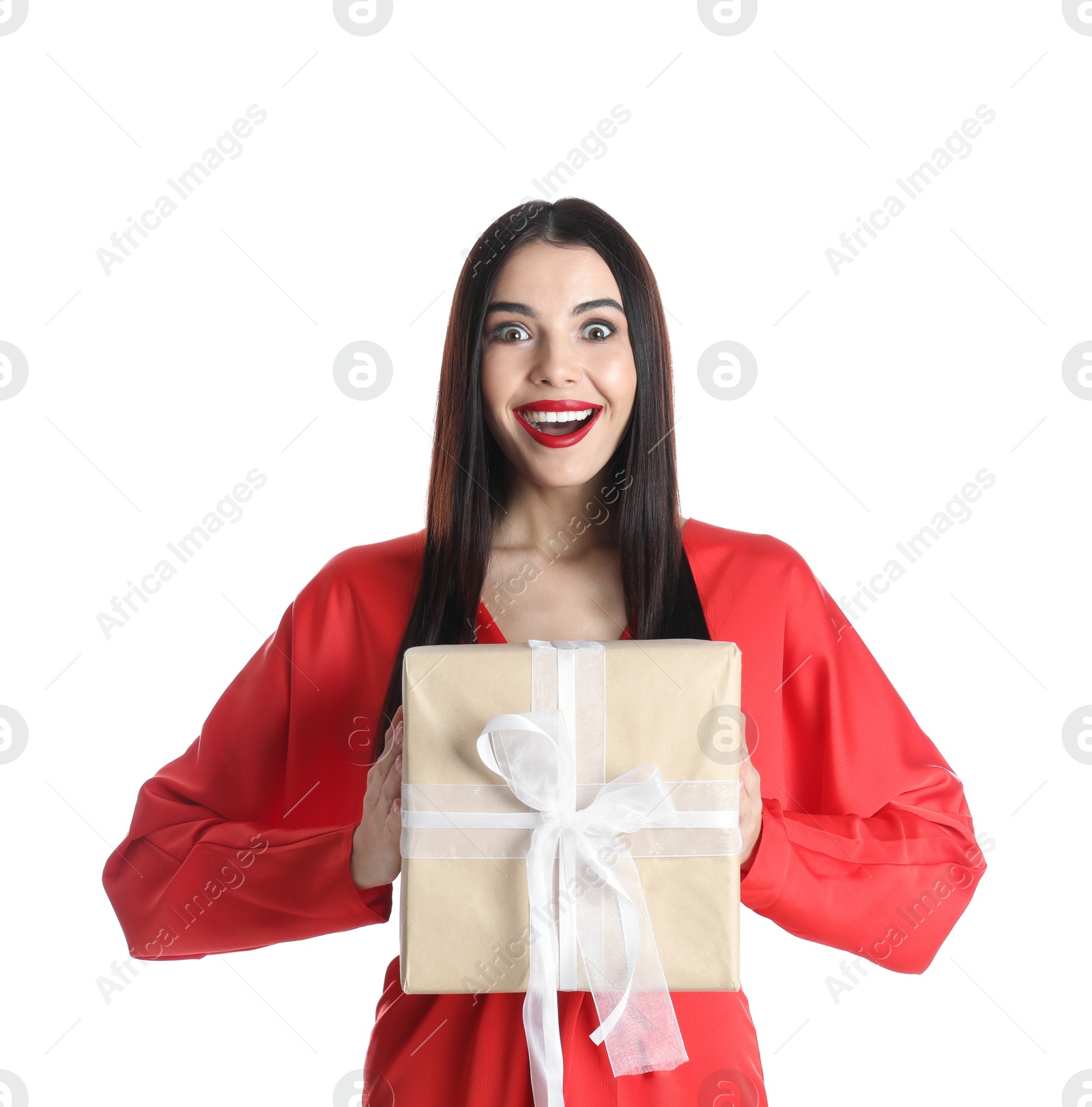 Photo of Excited woman in red dress holding Christmas gift on white background