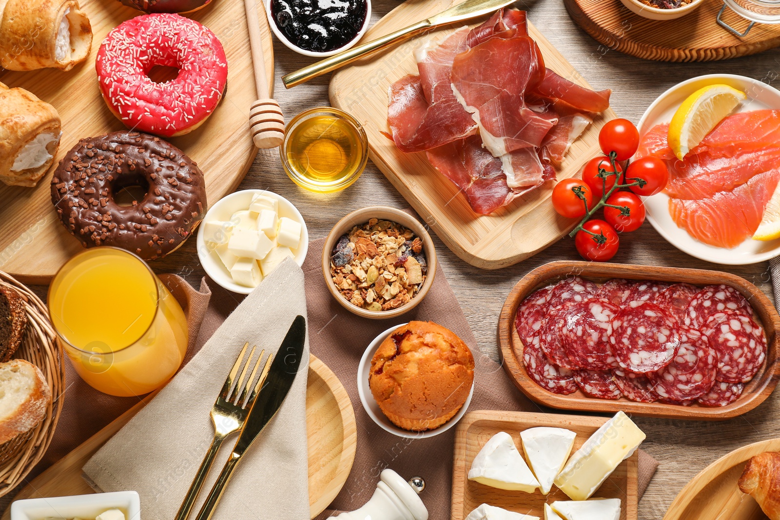 Photo of Different tasty food served for brunch on wooden table, flat lay