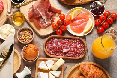 Photo of Different tasty food served for brunch on wooden table, flat lay