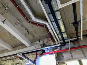 Photo of Pressurisation ductwork system on ceiling indoors, view from below