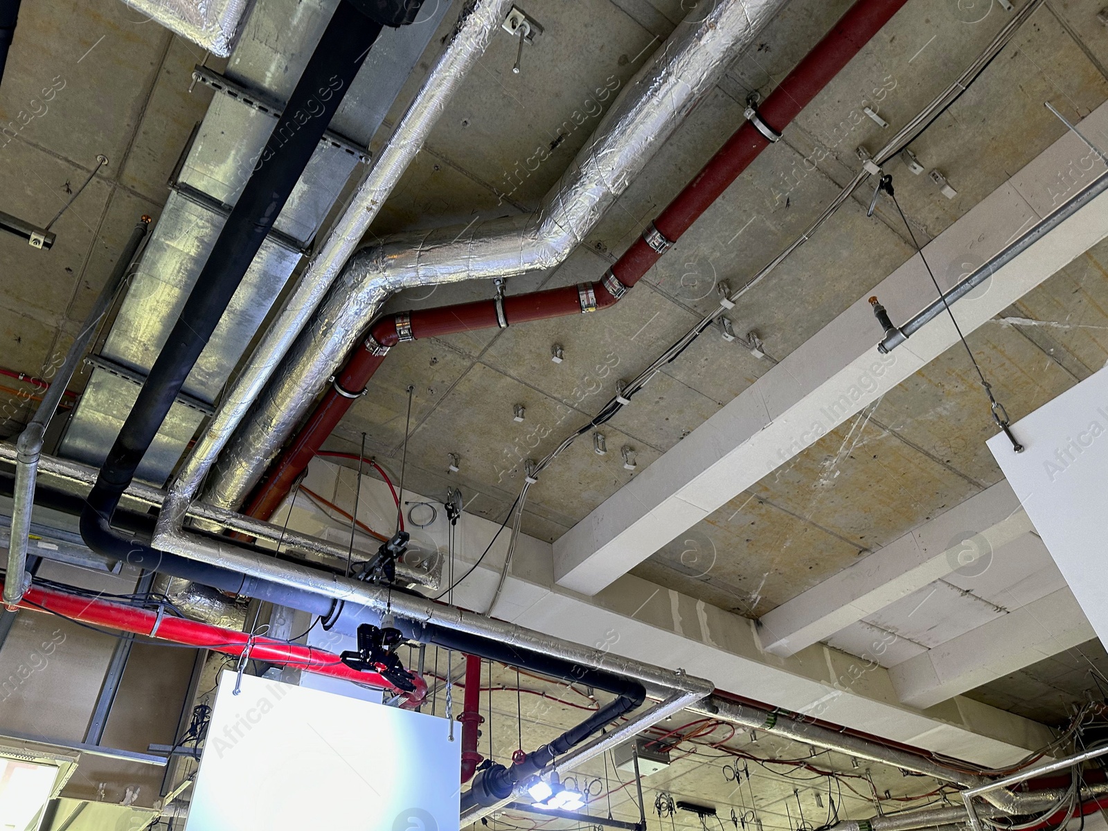 Photo of Pressurisation ductwork system on ceiling indoors, view from below