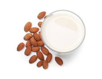 Glass of almond milk and nuts isolated on white, top view