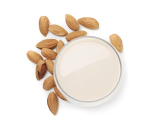 Glass of almond milk and nuts isolated on white, top view