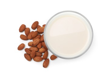 Glass of almond milk and nuts isolated on white, top view