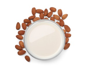 Photo of Glass of almond milk and nuts isolated on white, top view