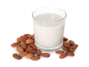 Glass of almond milk and nuts isolated on white