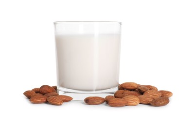 Glass of almond milk and nuts isolated on white