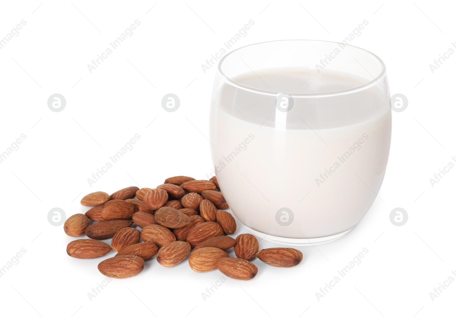 Photo of Glass of almond milk and nuts isolated on white