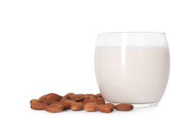 Photo of Glass of almond milk and nuts isolated on white