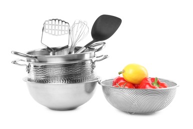 Photo of Dishware, cooking utensils with vegetables and lemon isolated on white