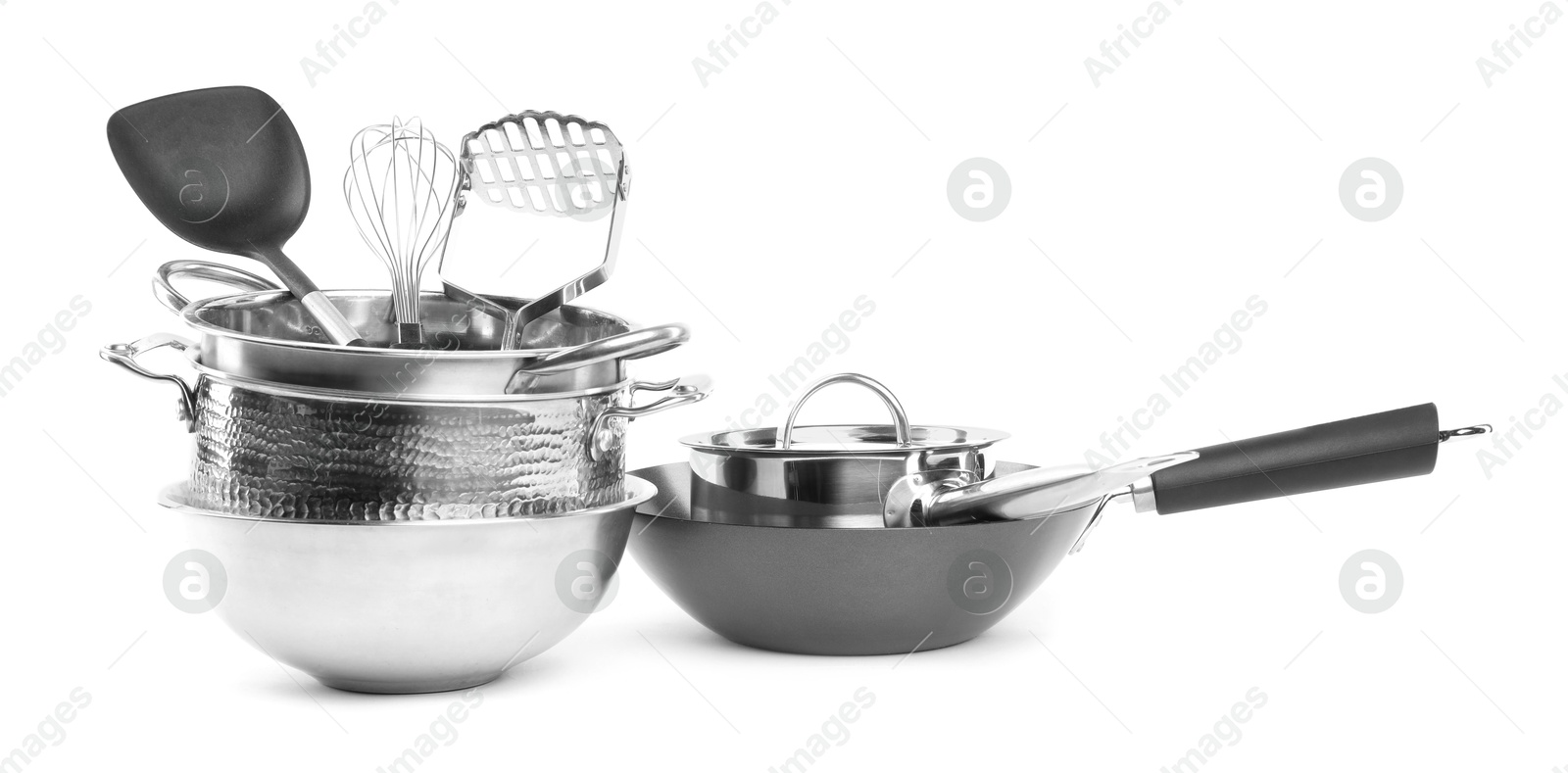 Photo of Dishware and cooking utensils isolated on white