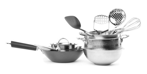 Dishware and cooking utensils isolated on white