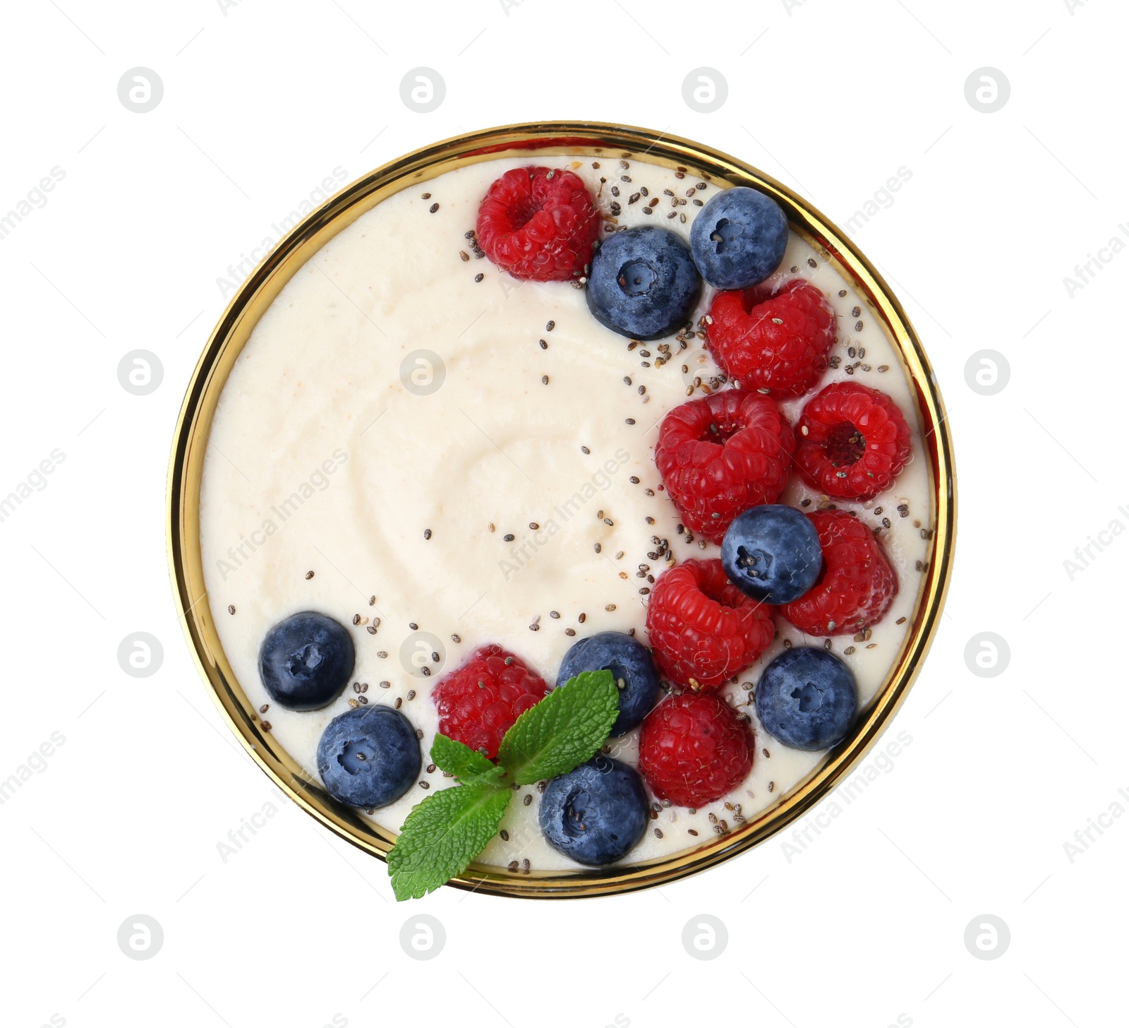 Photo of Tasty cooked semolina porridge with berries and mint isolated on white, top view