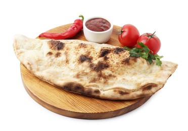 Delicious calzone with ketchup, fresh tomatoes and chili pepper isolated on white